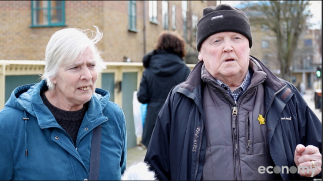 A screen grab of an older couple in East London talking to camera